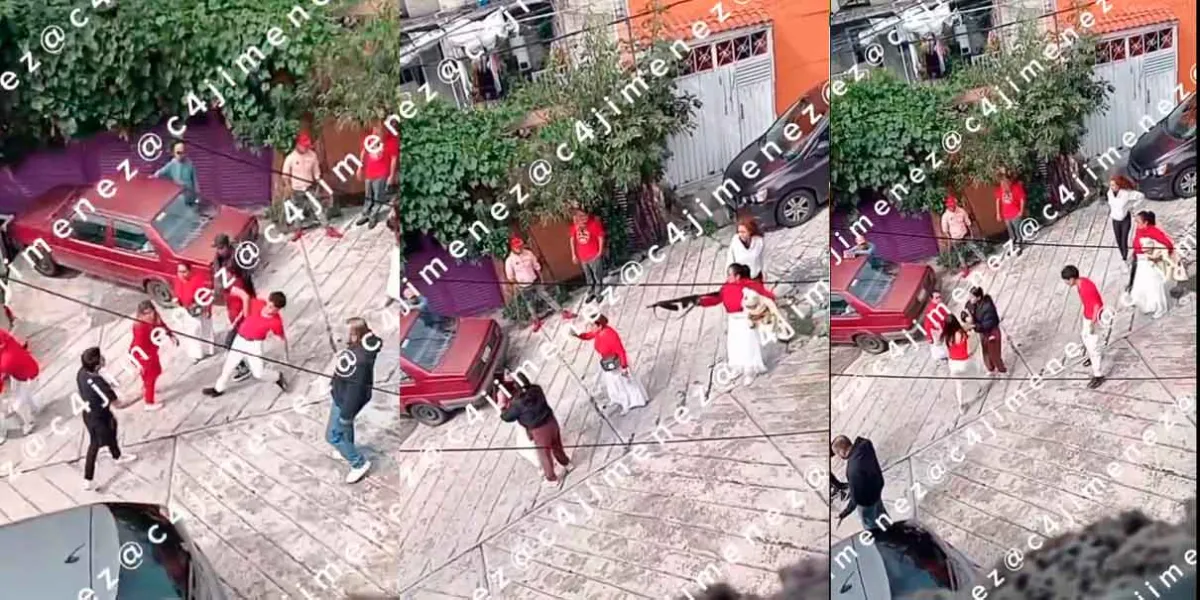 VIDEO. Mujer amenaza con arma larga mientras carga a un bebéen Naucalpan